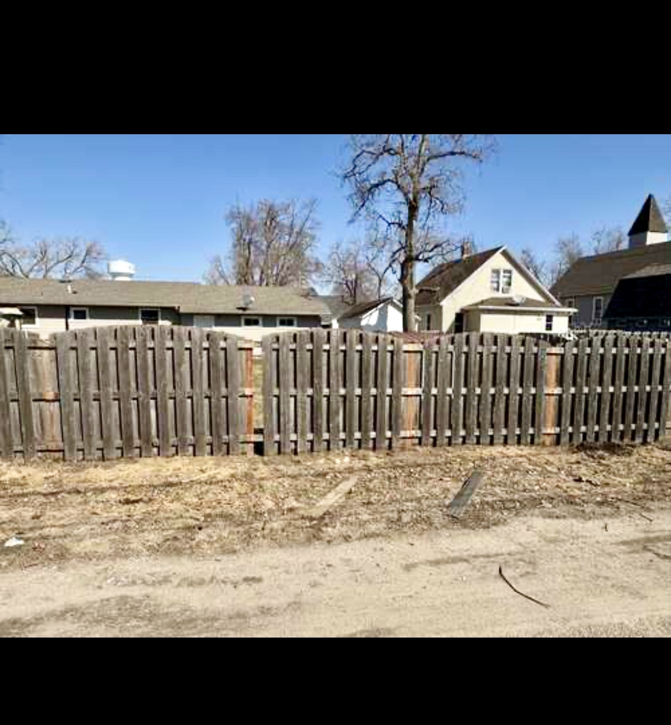 Wood fence repair project showing the fence posts first